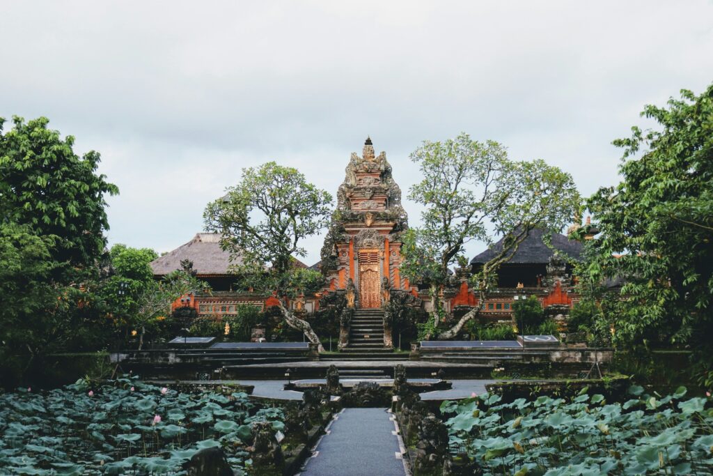 The iconic lotus pond and intricate traditional architecture of the Saraswati Temple in central Ubud